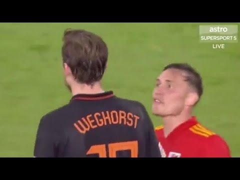 Wout Weghorst and Connor Roberts clash swearing during Wales vs Netherlands at Nations League