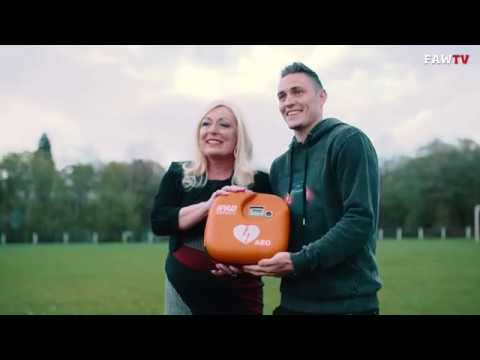 Wales defender Connor Roberts delivers Defib and training to local club