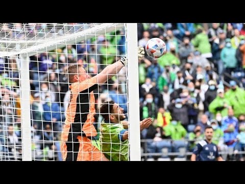 Sporting KC goalkeeper Tim Melia body slammed Sounders midfielder Cristian Roldan to the ground!
