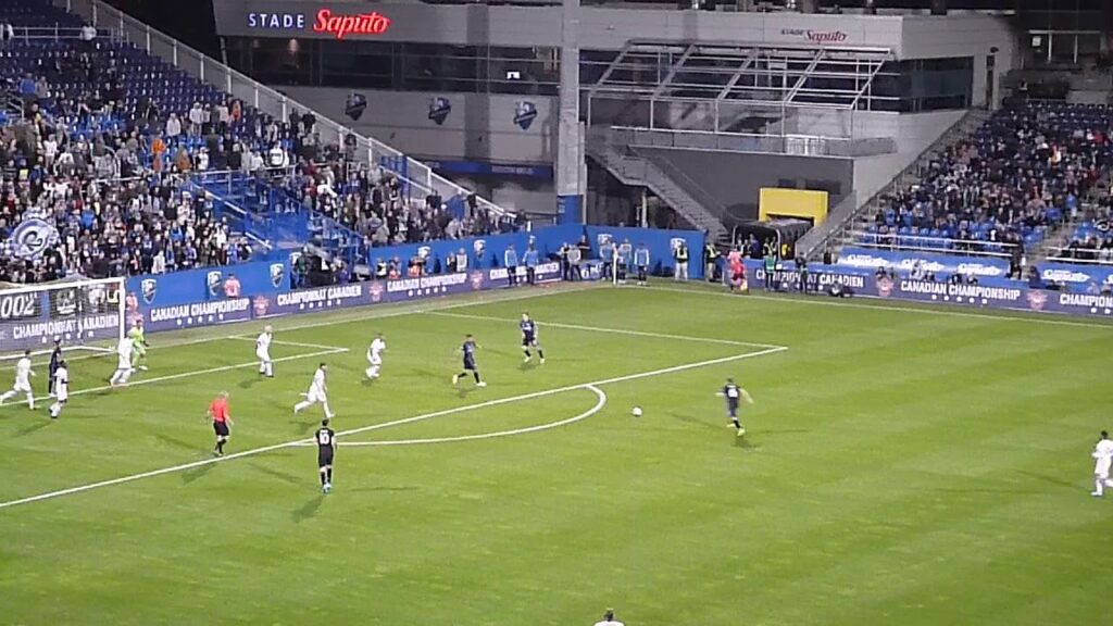 Alex Bono of Toronto FC stops Montreal Impact's Samuel Piette in Canadian Championship 9/18/19