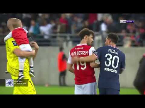 MESSI TAKES PICTURE WITH REIMS goalkeeper Predrag Rajkovic's son on his psg debut.