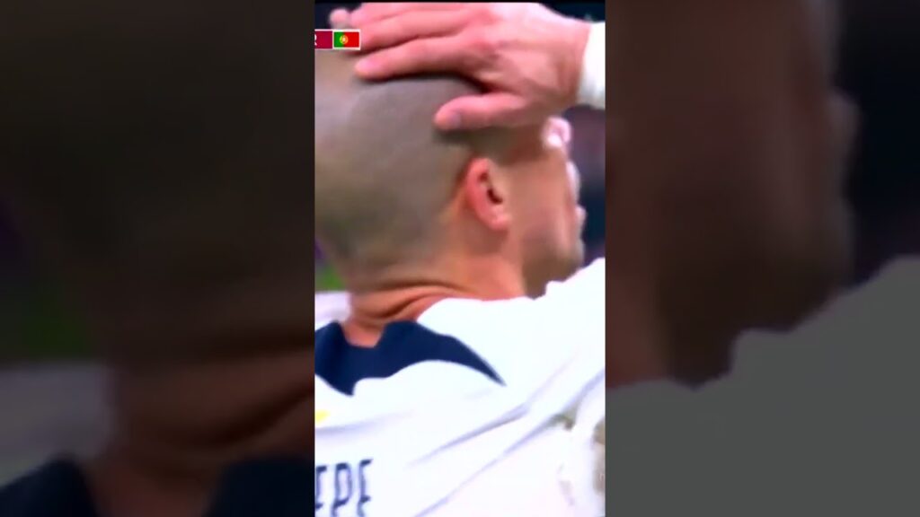 Morocco player Jawad El Yamiq kisses Pepe's head