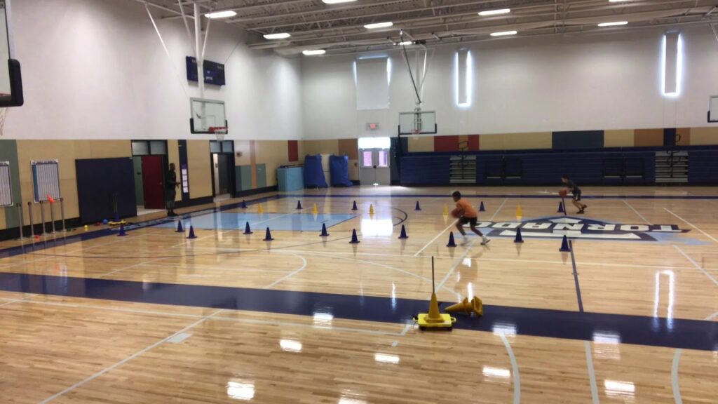 Ethan Horvath and Kanaan Brown with Basketball Addict Training's Dwayne Bryant