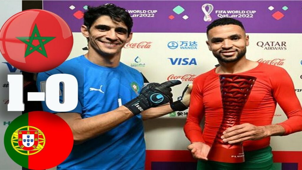 Yassine Bounou awards the Man of the Match award to his colleague Youssef Al-Nusairi