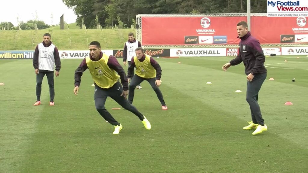 Wayne Rooney slide tackles John Stones in intense practice drill