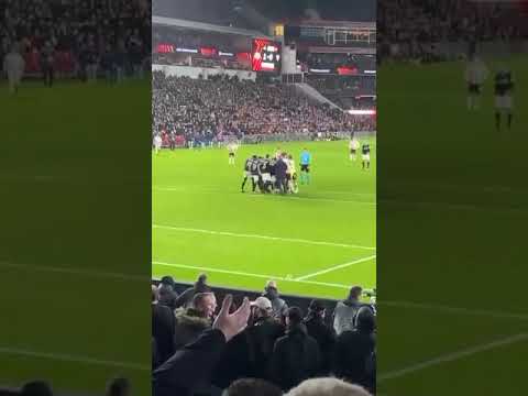 Sevilla goalkeeper Marko Dmitrovic calmly incapacitates a PSV hooligan who tries to punch him 23/02