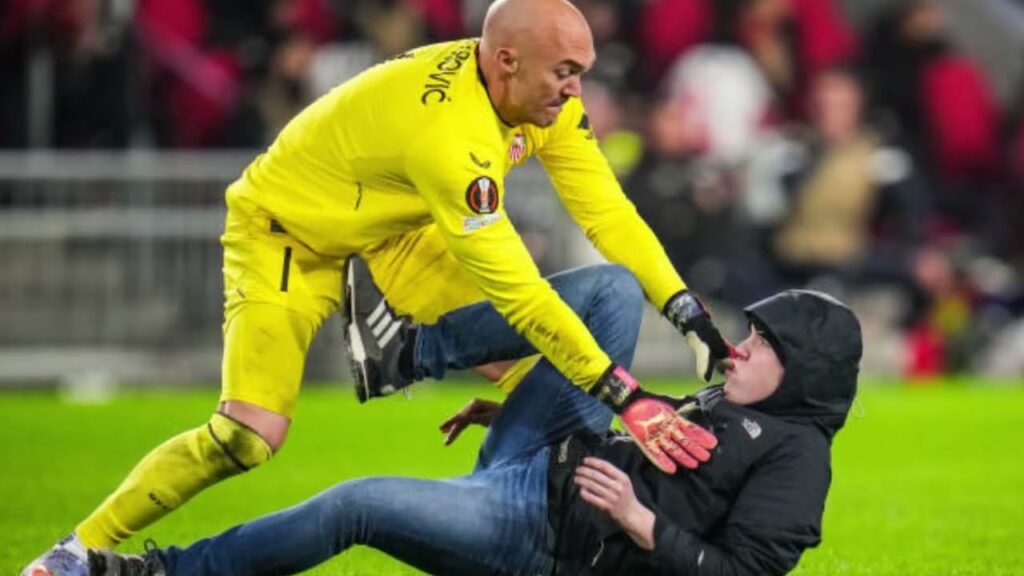 Sevilla Goalkeeper Marko Dmitrovic Attacked by a Pitch Invader