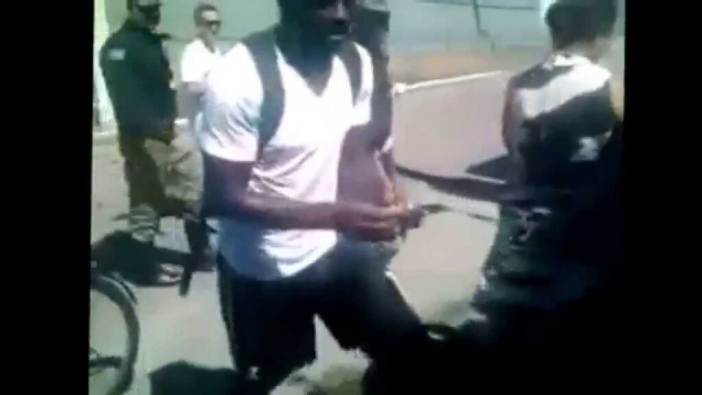 SULLEY MUNTARI GIVING SOME MONEY TO THE POOR