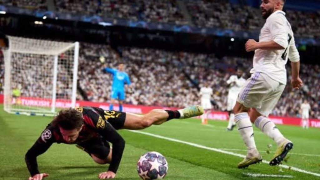 Grealish shoved into advertising board by Carvajal