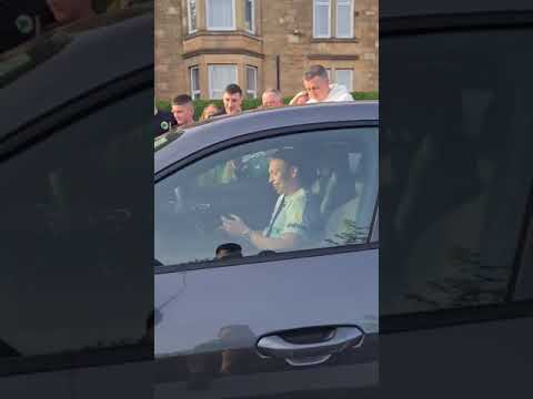 Celtic fans swamp Alistair Johnston's car to celebrate title win