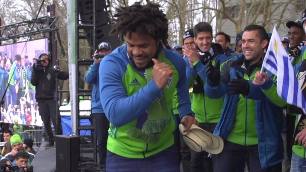 Roman Torres dances at Championship Rally...Jordan Morris does not