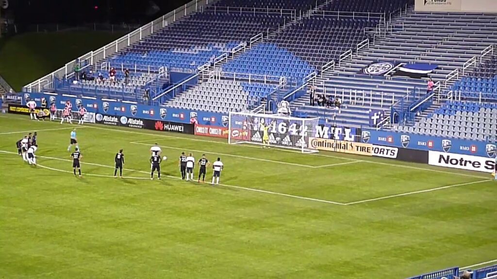 Montreal Impact's Clément Diop stops Vancouver Whitecaps' Lucas Cavallini's penalty kick 8/25/20