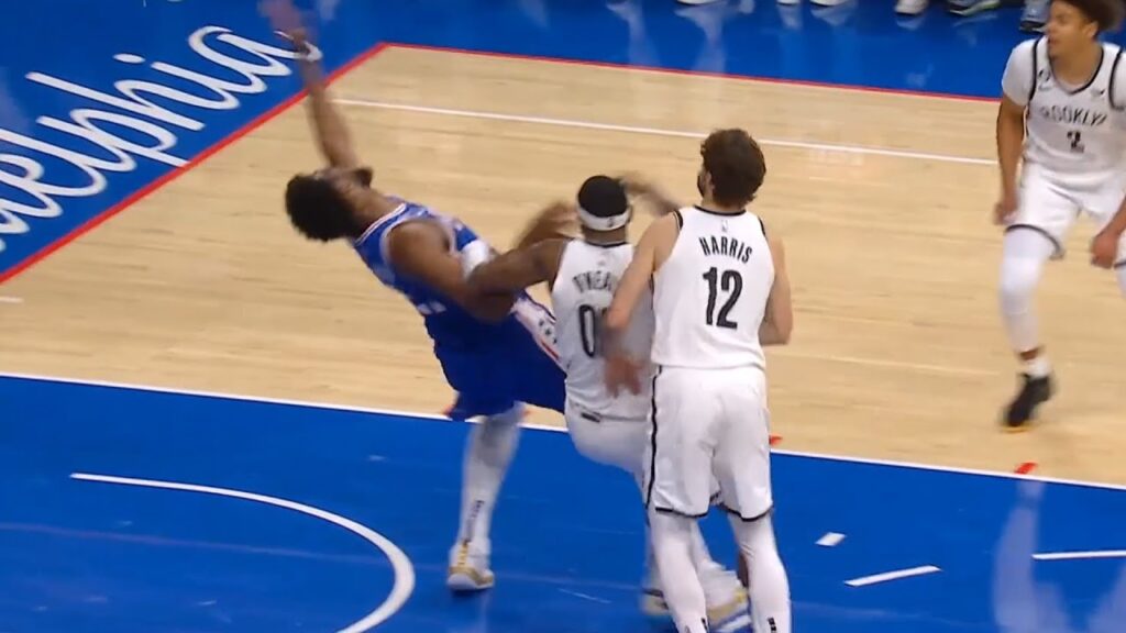 Joel Embiid with a crazy flop after battling with Royce O'Neale 😂