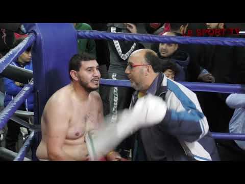 Abdulrahman Abdelkarim: black trunks vs Bahi Zaki: red/white