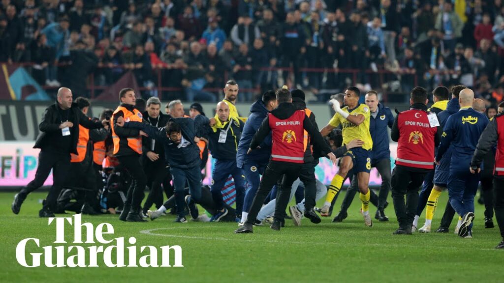 Trabzonspor fans storm pitch and attack Fenerbahce players in latest ugly Super Lig scenes Trabzonspor fans storm pitch and attack Fenerbahce players in latest ugly Super Lig scenes