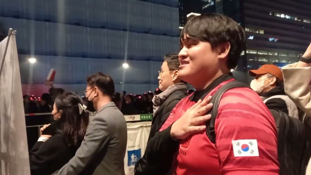 Cho Gue Sung's supporters sing their national anthem b4 South Korea's World Cup match vs Portugal