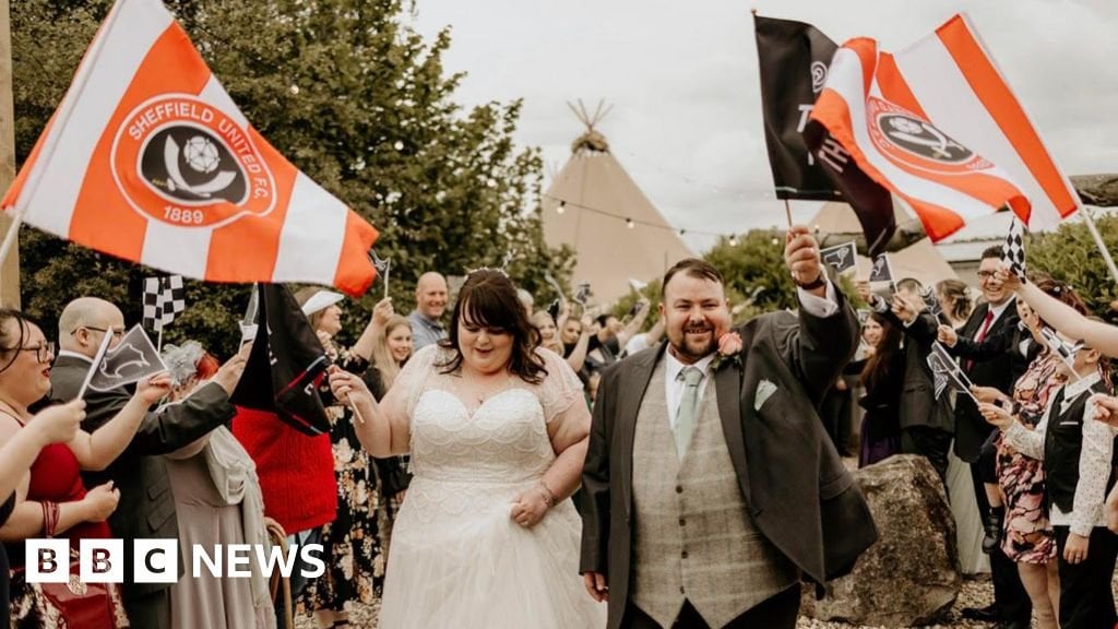 Derby County fans' wedding photobombed by rival flags