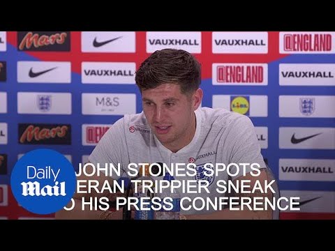 John Stones spots Kieran Trippier sneak into his press conference