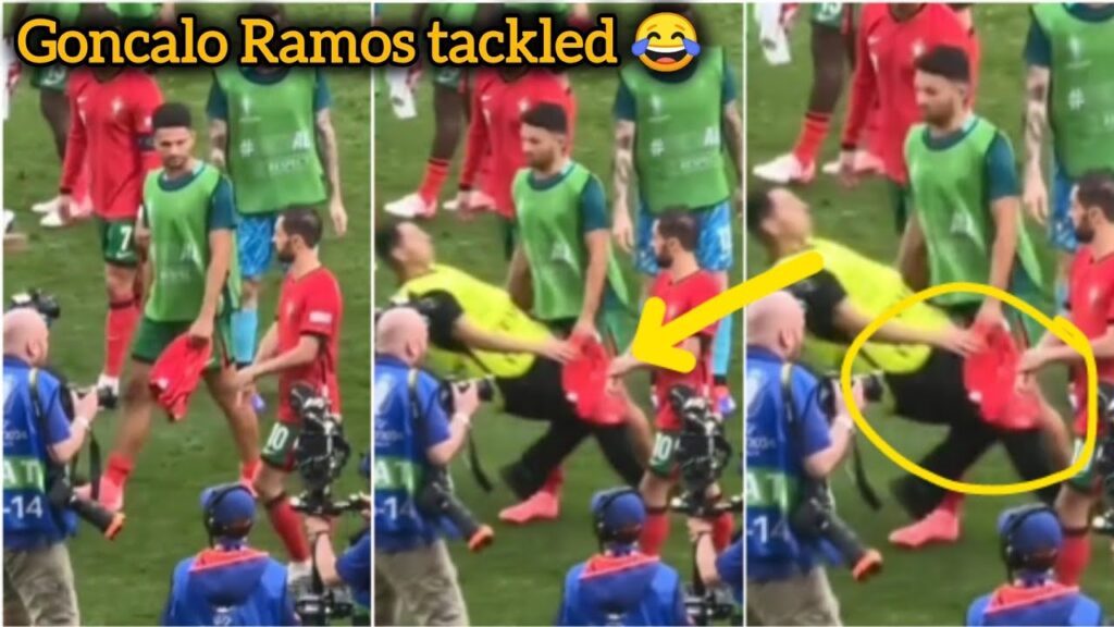 Goncalo Ramos gets tackled by a security guard at full time vs Turkey