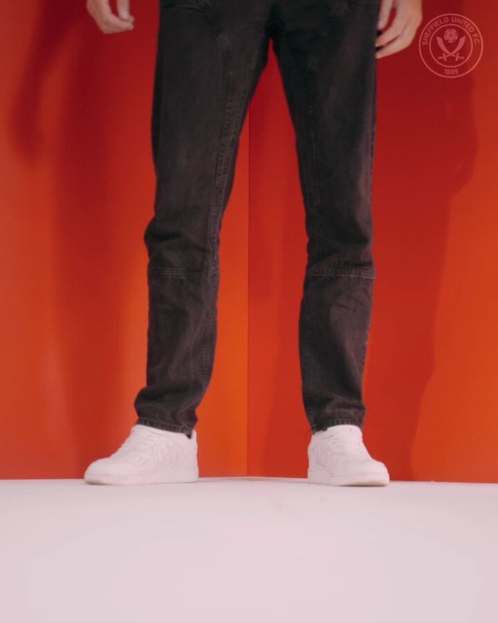 Harry Souttar signs.