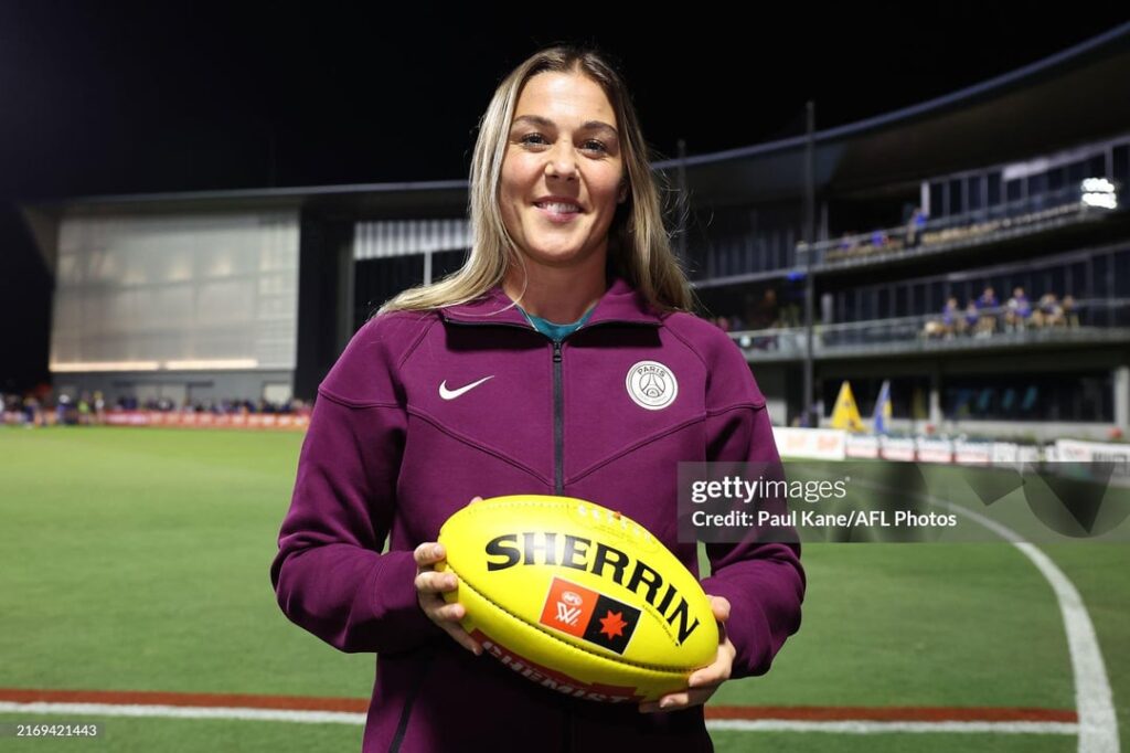 Mary Earps doing the coin toss at an AFLW game in Perth.
