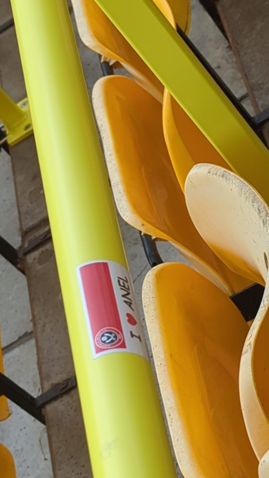 Sticker left on a railing at Norwich.