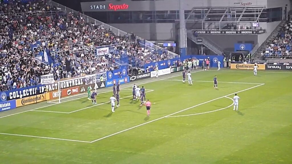 Kristijan Kahlina of Charlotte FC dives to stop Samuel Piette of CF Montreal (Impact) 9/14/24