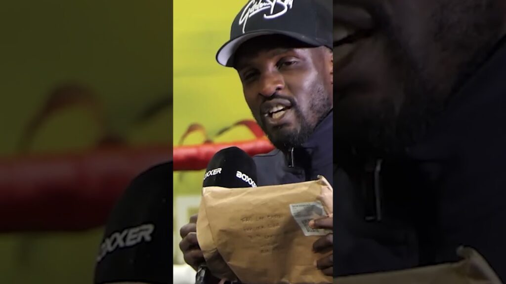 Ohara Davies TAUNTS Shane McGuigan with CARL FRAMPTON BOOK at Adam Azim press conference