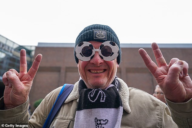 One spectator donned football glasses with spirits high ahead of the party getting underway