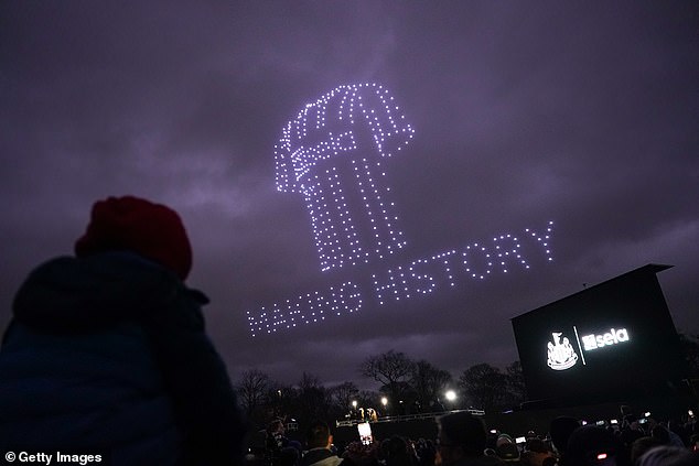 Fans watch a drone display as they gather on the Town Moor in Newcastle to celebrate Newcastle United Football Club's Carabao Cup success