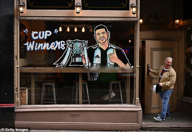 A bar in Newcastle with a mural of Newcastle United captain Bruno Guimaraes in the front window