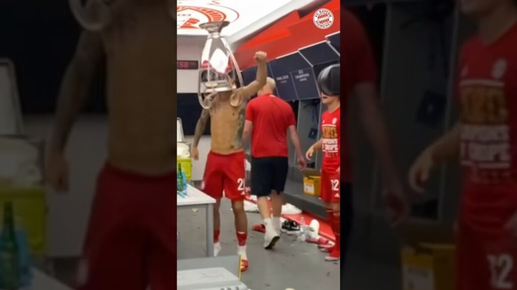 Lucas Hernández celebrating with his head inside the Champions League trophy after Bayern's title