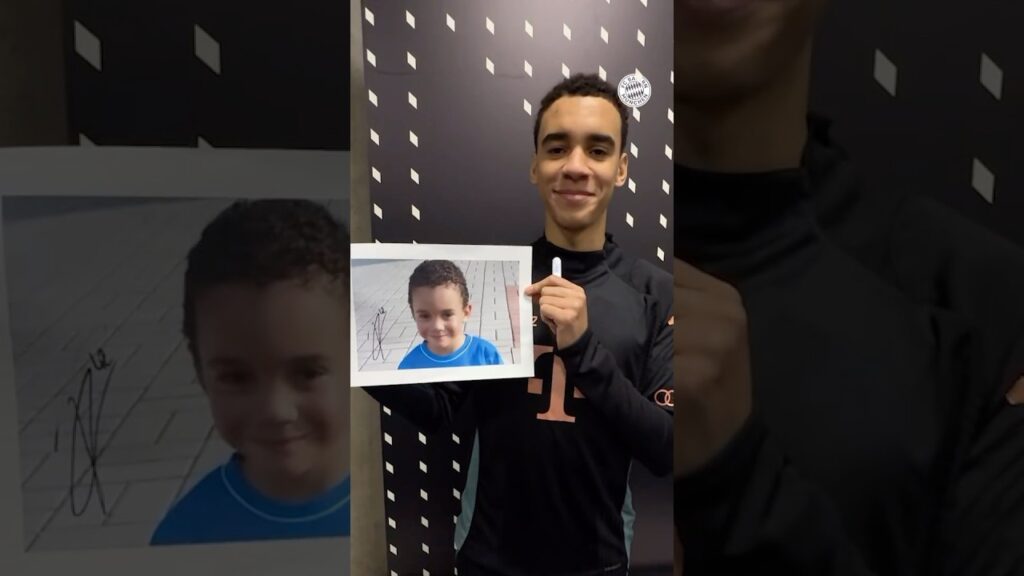 Jamal Musiala signing his childhood photo