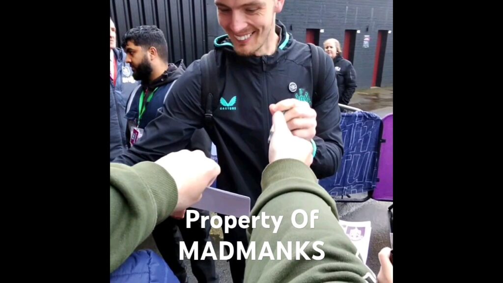 Nick Pope happy to be back at Burnley and sign autographs for the people waiting.