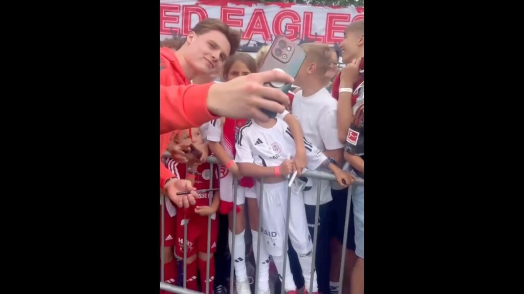 Jonas Urbig and Dayot Upamecano taking time for the fans during Red Eagles Austria vs Bayern