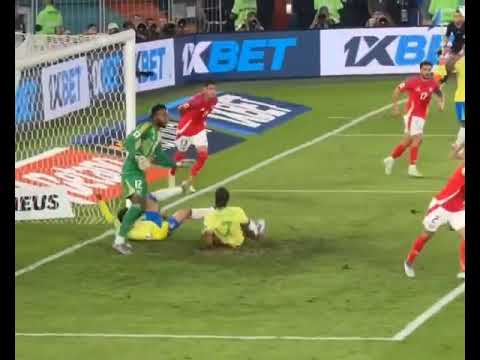 Joao Pedro launches a tackle at his own teammate Gabriel Martinelli