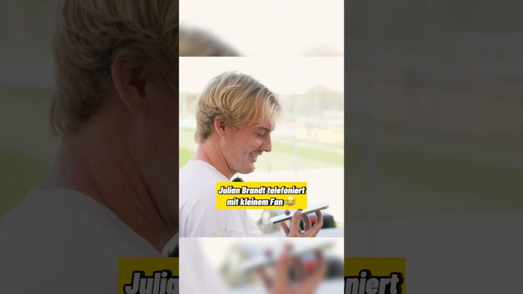 Julian Brandt telefoniert mit kleinem Fan 😂￼