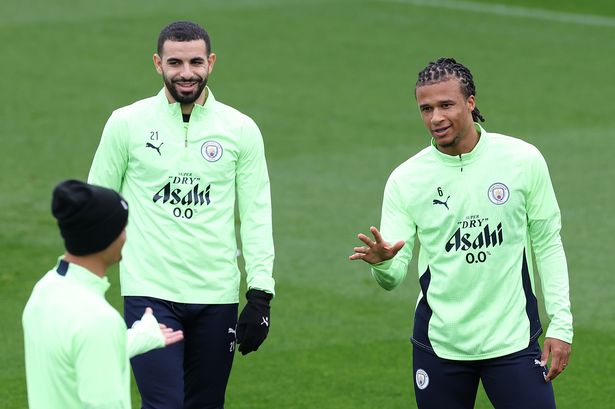MANCHESTER, ENGLAND - OCTOBER 20: Rayan Ait-Nouri and Nathan Ake of Manchester City smile in a training session at Manchester City Football Academy on October 20, 2025 in Manchester, England.  (Photo by Alex Livesey/Getty Images)