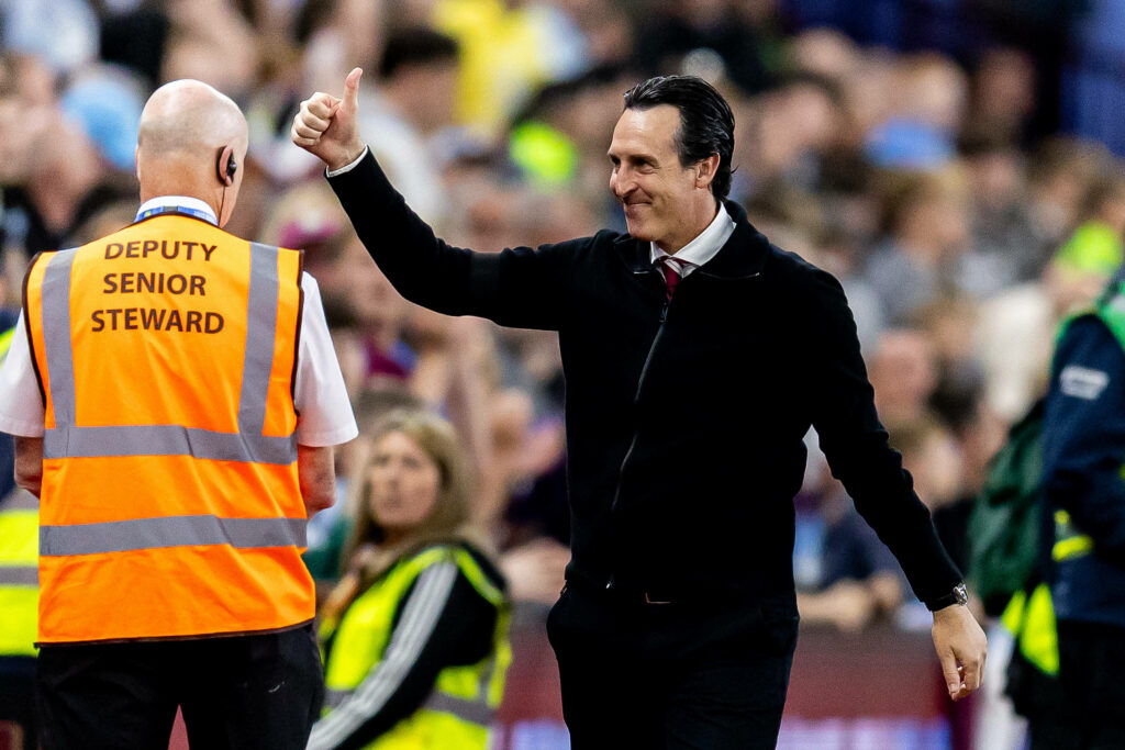 Unai Emery holding his thumb up towards Aston Villa fans