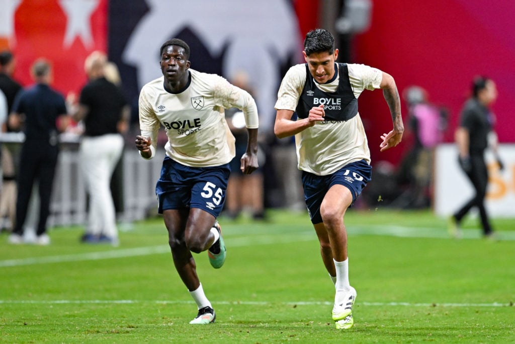 Young West Ham star Mohamadou Kante warms up alongside Edson Alvarez