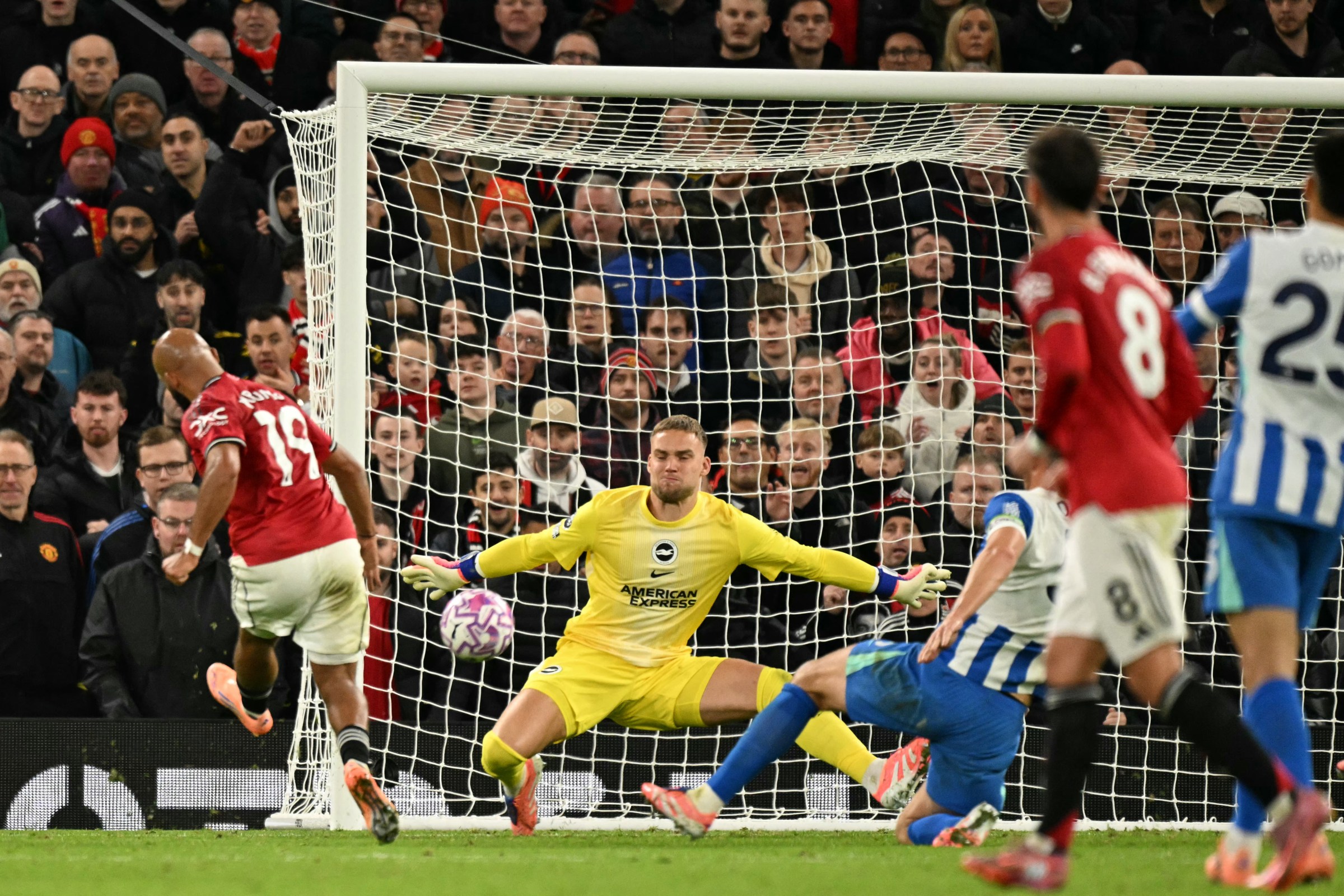 TOPSHOT - Manchester United’s Cameroonian midfielder #19 Bryan Mbeumo (L) shoots to score his second and United’s fourth goal for 4-2 during the English Premier League football match between Manchester United and Brighton and Hove Albion at Old Trafford in Manchester, north west England, on October 25, 2025. (Photo by Oli SCARFF / AFP) / RESTRICTED TO EDITORIAL USE. No use with unauthorized audio, video, data, fixture lists, club/league logos or ‘live’ services. Online in-match use limited to 120 images. An additional 40 images may be used in extra time. No video emulation. Social media in-match use limited to 120 images. An additional 40 images may be used in extra time. No use in betting publications, games or single club/league/player publications. / (Photo by OLI SCARFF/AFP via Getty Images)