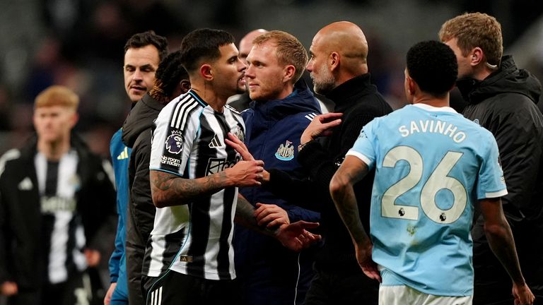 Newcastle United's Bruno Guimaraes and Manchester City manager Pep Guardiola at the final whistle. Pic: PA