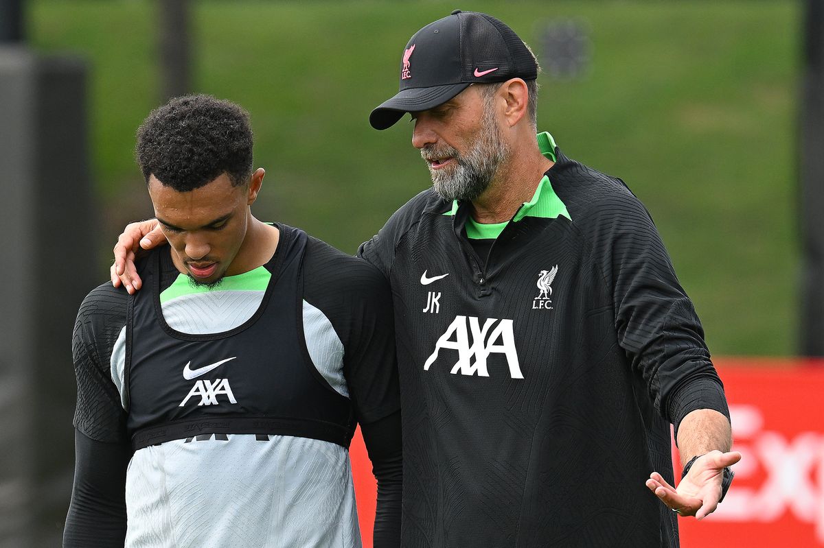 Jurgen Klopp manager of Liverpool and Trent Alexander-Arnold of Liverpool during a training session at AXA Training Centre on August 16, 2023 in Kirkby, England. 