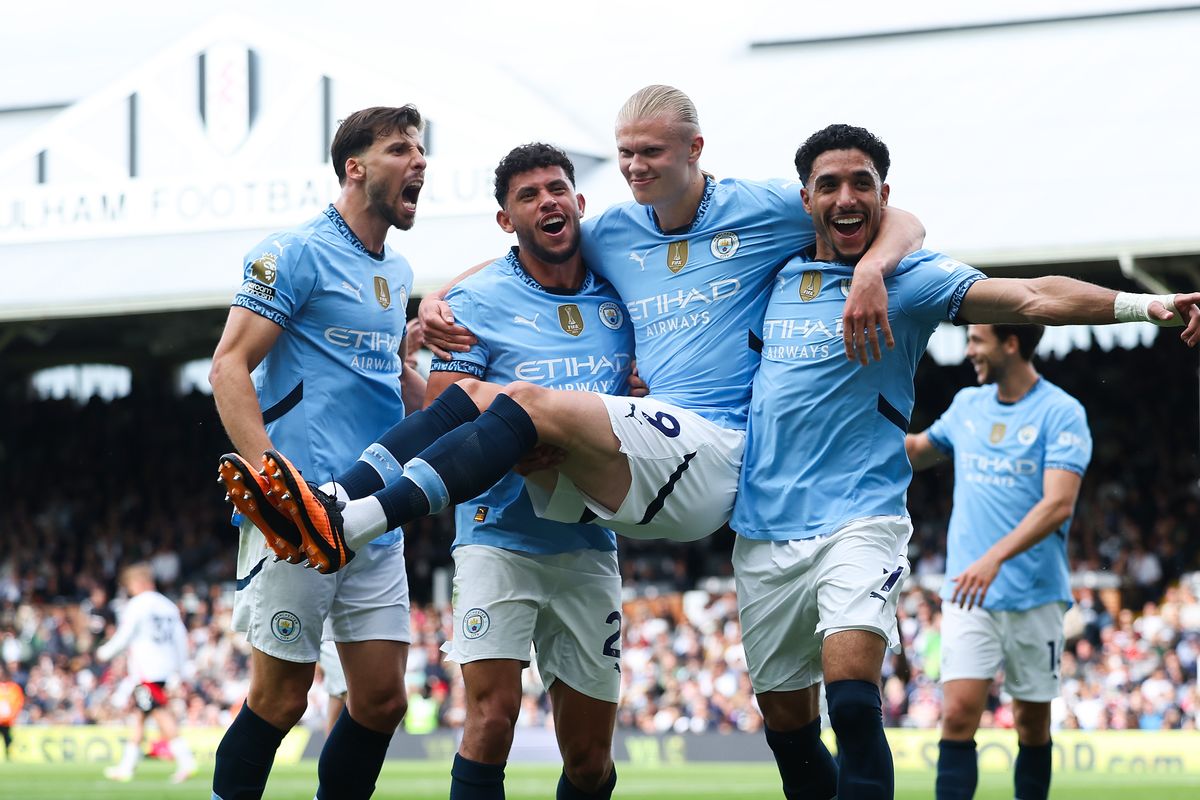 Omar Marmoush celebrates a Manchester City goal with Erling Haaland