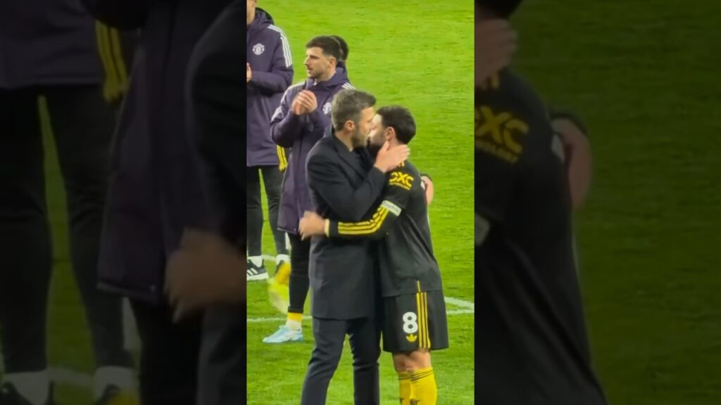 Michael Carrick and Bruno Fernandes embrace fulltime after win over Arsenal