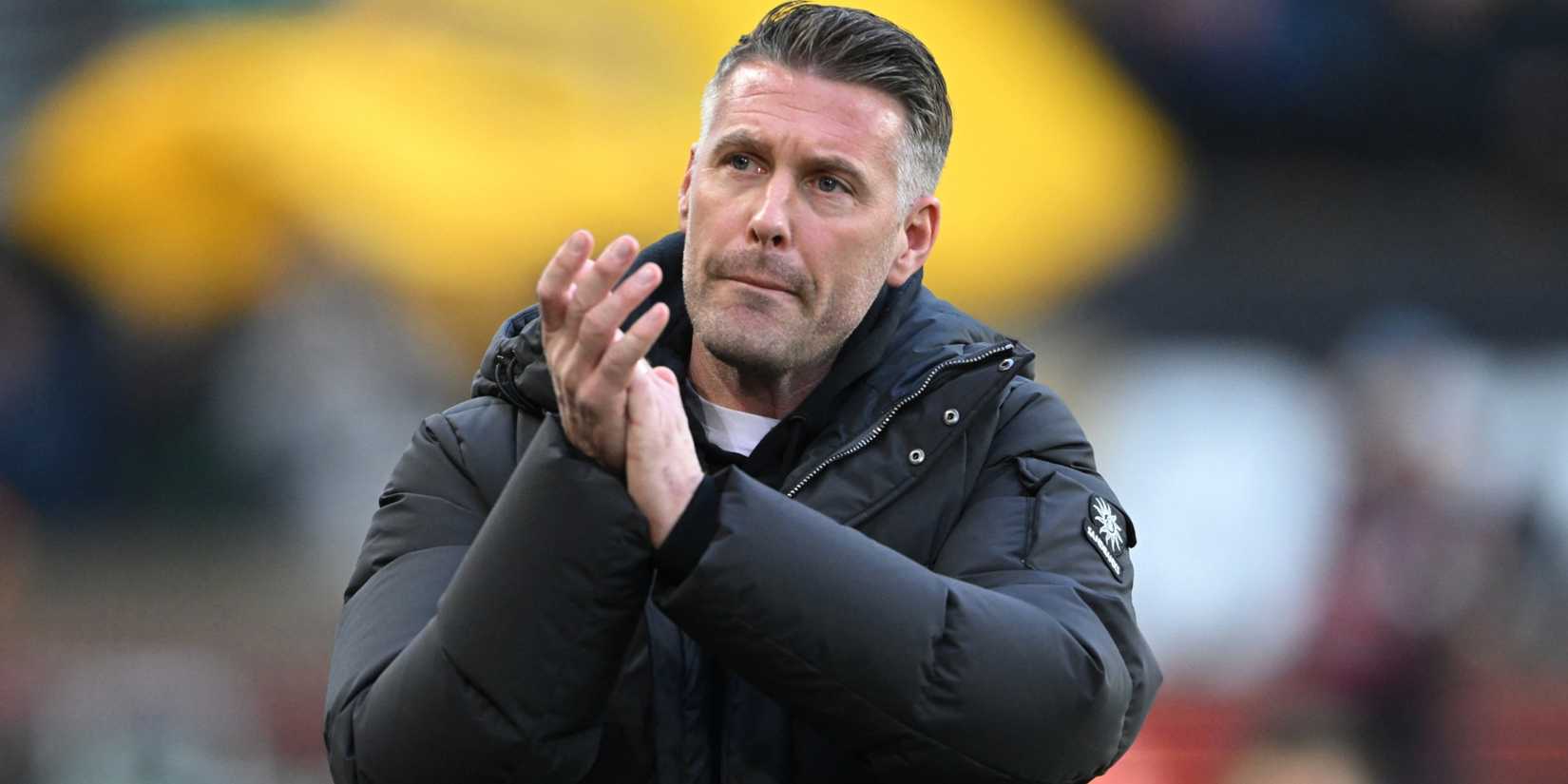 Wolves manager Rob Edwards claps the fans