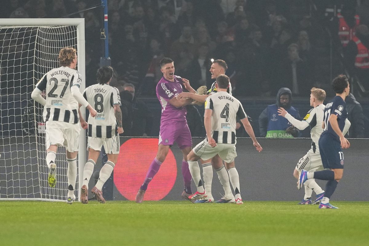 Newcastle United's Nick Pope celebrates saving Ousmane Dembele's penalty