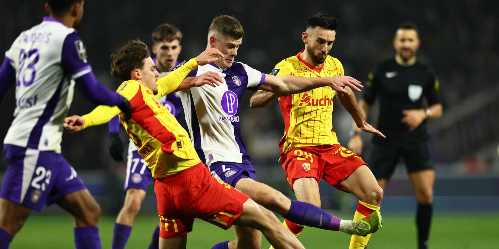 Toulouse's Charlie Cresswell in action with RC Lens's Adrien Thomasson
