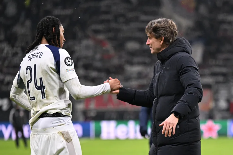Tottenham Hotspur’s Danish head coach Thomas Frank celebrates with Tottenham Hotspur’s English defender #24 Djed Spence after the UEFA Champions League league phase- day 8 football match between Eintracht Frankfurt and Tottenham Hotspur in Frankfurt, western Germany, on January 28, 2026.