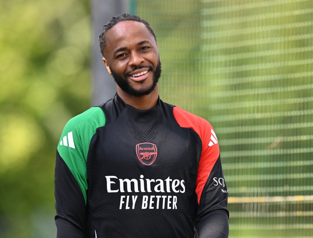 Raheem Sterling smiles in training.